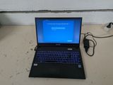 a laptop that is sitting on a table with a charger