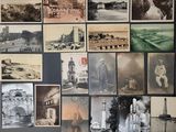 many pictures of old photos hanging on the wall