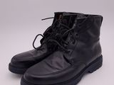 a pair of black leather boots on a white background