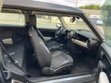 the interior of a car with the door open and the passenger seat up