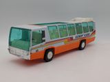 a toy bus that is sitting on a white surface