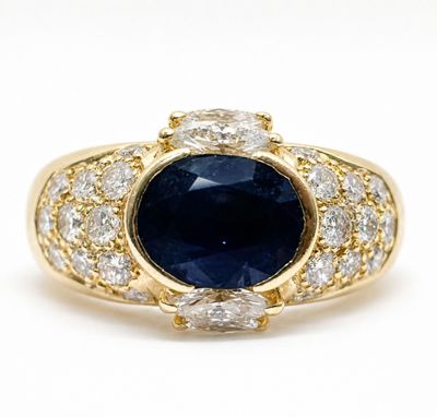 an oval sapphire and diamond ring