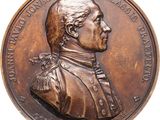 an image of a bronze medal with a portrait of a man on it