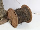 a spool of thread and a spool of thread on a table