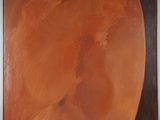 an orange painting on a white wall with a black background