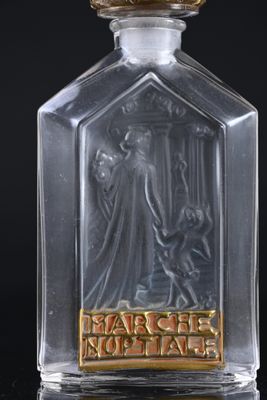 a close up of a glass bottle with an image of a woman on it