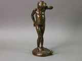 an antique bronze statue of a young boy on a pedestal