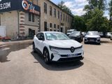 a white car parked in front of a building with cars parked in front of it