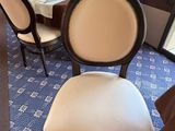 a dining room with a table and chairs in it