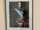 a picture of a man in a military uniform hanging on a wall