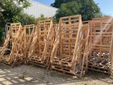 many wooden pallets stacked on top of each other