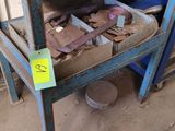a blue work bench with a lot of tools on it