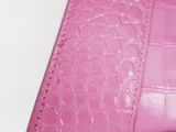 the inside of a pink purse with a zipper on it