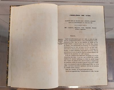 an open book on display in a glass case