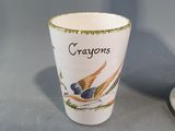 a cup with a picture of a bird on it