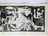 an open book with a black and white drawing of a man on a horse