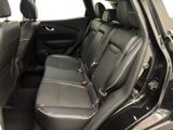 the back seats of a car are empty and the passenger seats are empty