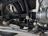 a close up of a motorcycle engine on a street