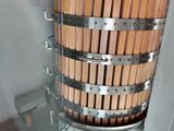 an image of a machine that is making a wooden bucket