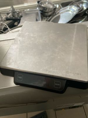 a laptop sitting on top of a kitchen counter
