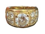 an image of a gold ring with diamonds on it