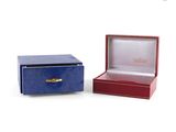 an image of two boxes with a ring inside of them