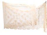 lacy white lace shawl hanging on a clothes line