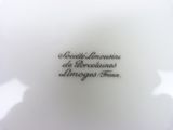 the plate is white and has black writing on it