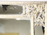 a mirror that is sitting on the wall