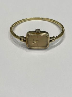 an image of a gold bracelet with a square shaped watch on it