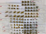 a lot of different types of nuts in a plastic box