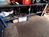a garage with a lot of clutter and tools on it