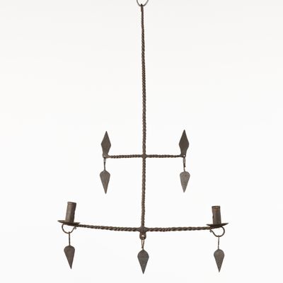wrought iron chandelier with four lights and a rope