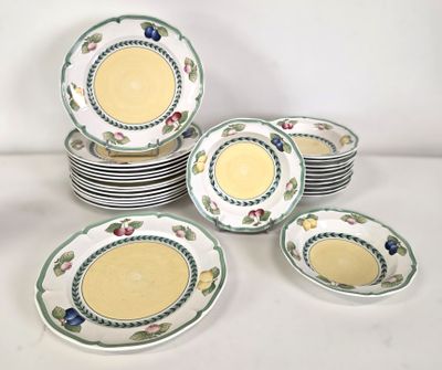 a lot of plates that are sitting on a table