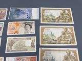 a lot of different bank notes on the table