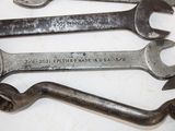 many wrenches that are sitting on a table