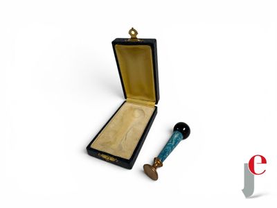 a small wooden box with a blue handle next to it