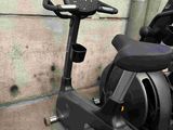 a stationary exercise bike in the corner of a room