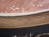 a close up of a table with a clock on top of it