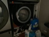a washer and a dryer in a small room