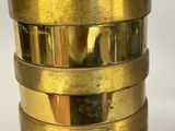 brass plated table lamp with a brass shade on a white background