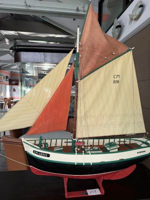 a model of a sailboat on display in a museum