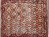 un ancien tapis persan à motifs rouges et bleus