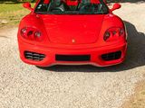 a red sports car parked on the side of the road