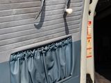 a car door with a curtain on the side of it