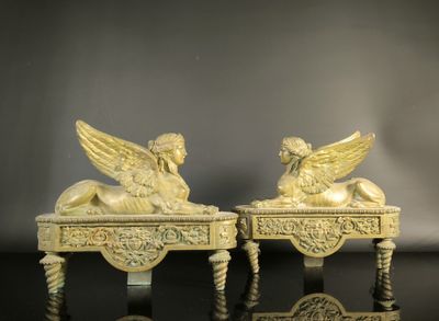 pair of carved ivory figurines of angels on a table