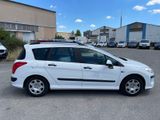 a picture of a small white car parked in a parking lot