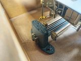 a machine that is sitting on the floor next to a table