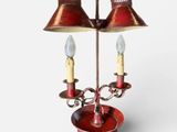three lamps that are on a stand on a white background