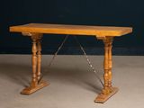 an image of a wooden table with two legs and a wooden top